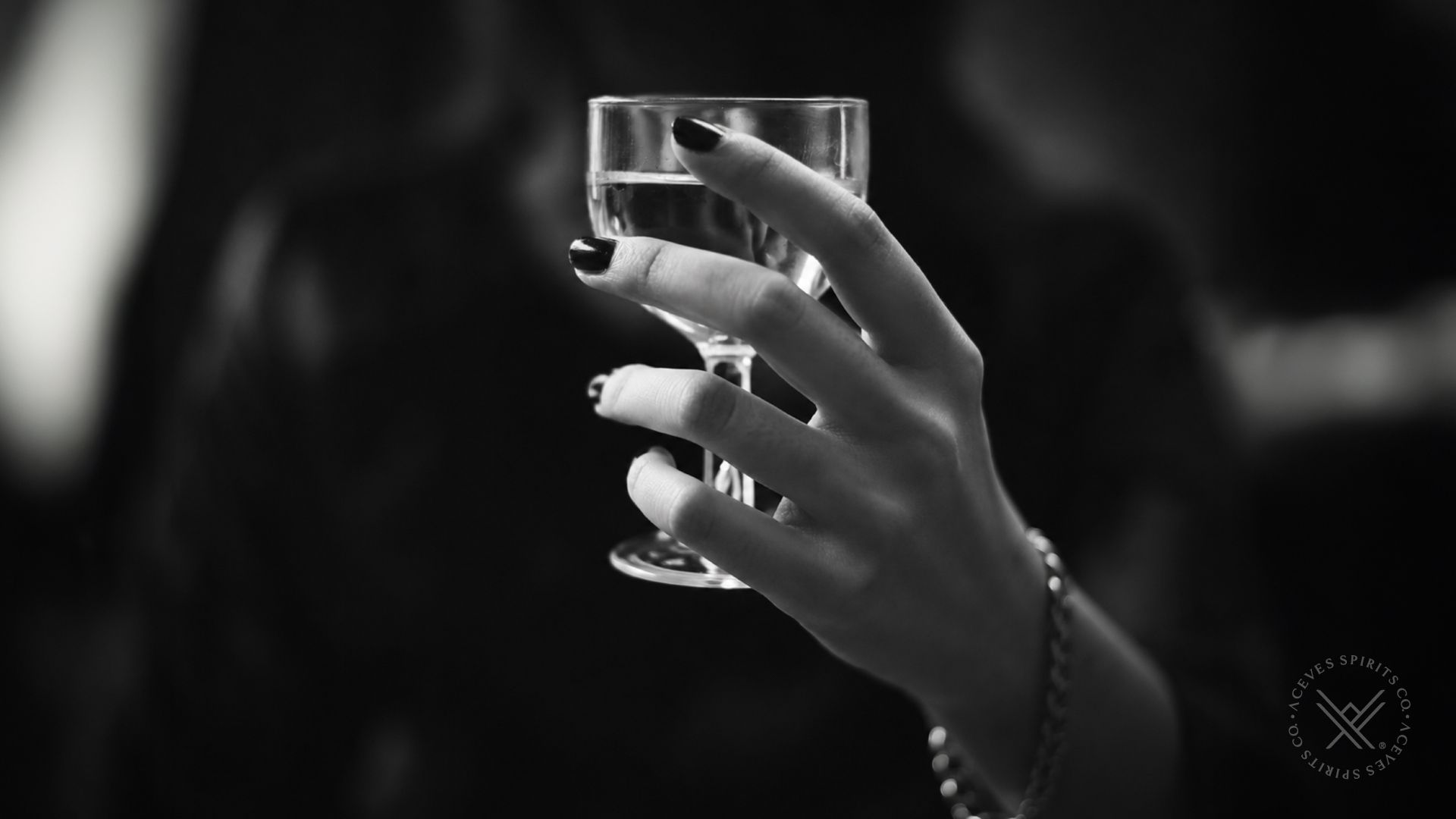 Woman holding a glass during a premium mezcal experience
